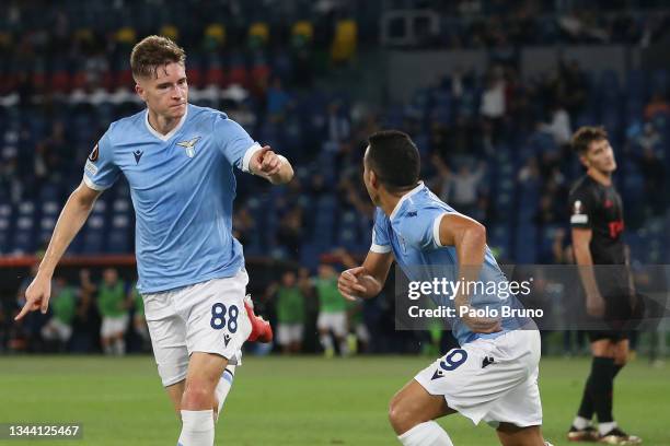 Toma Basic of SS Lazio celebrates with team mate Pedro after scoring their sides first goal during the UEFA Europa League group E match between SS...