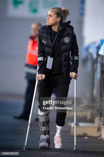 Steph Houghton of Manchester City walks around the pitch wearing a cast on her leg after suffering an ankle injury before the Vitality Women's FA Cup...