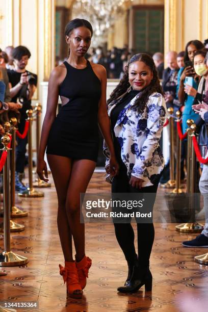 Designer Toi Cheri poses on the runway for Indigoz Shoes during the Flying Solo Womenswear Spring/Summer 2022 show as part of Paris Fashion Week on...