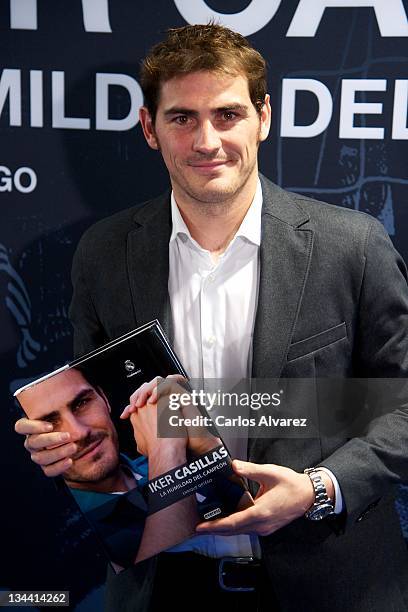 Real Madrid goalkeeper Iker Casillas poses for the photographers during the presentation of his biography "La Humildad del Campeon" at the Santiago...