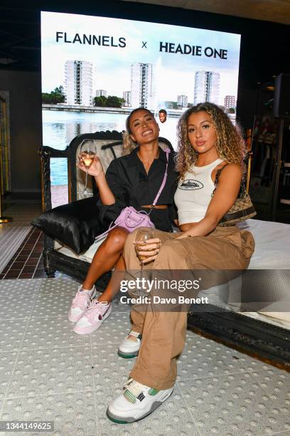 Kaz Crossley with guest attend the FLANNELS X HEADIE ONE exclusive listening party on September 30, 2021 in London, England.