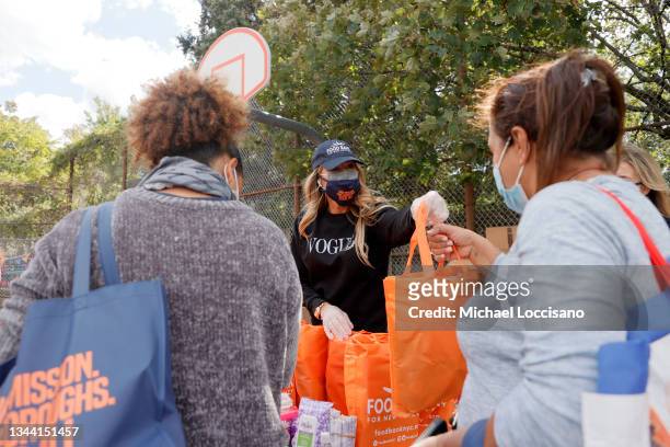 Kelly Killoren Bensimon helps distribute food and other items as Food Bank For New York City finishes it's Five Borough Pop Up Tour during Hunger...