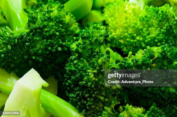 fresh organic steamed broccoli - steamed stock pictures, royalty-free photos & images