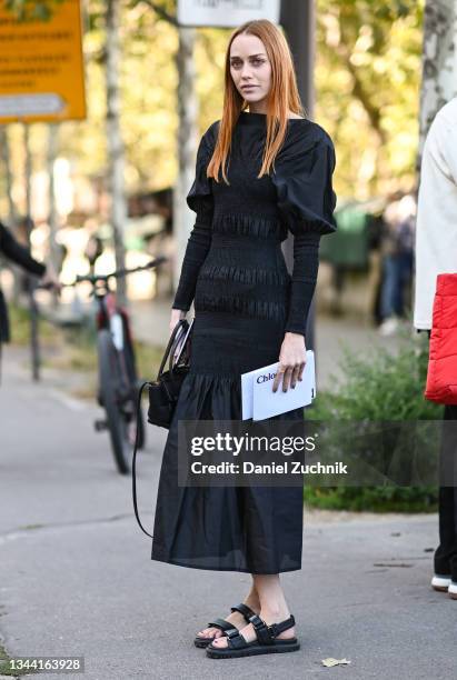 Tiernan Cowling is seen wearing a black Chloe dress outside the Chloe show during Paris Fashion Week S/S 2022 on September 30, 2021 in Paris, France.