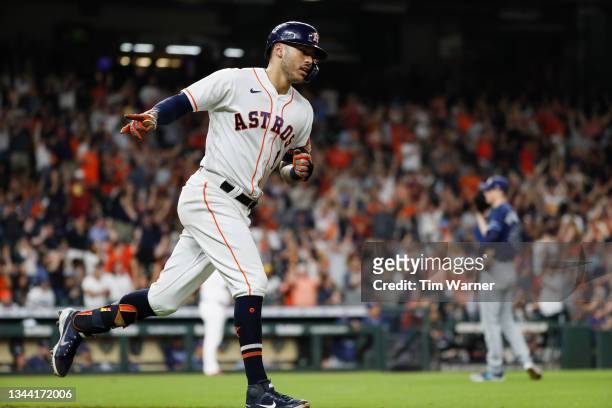 Carlos Correa of the Houston Astros hits a three run home run in the fourth inning against the Tampa Bay Rays at Minute Maid Park on September 30,...