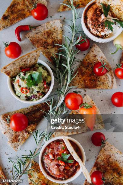 tortilla chips with sauces - dips stock pictures, royalty-free photos & images