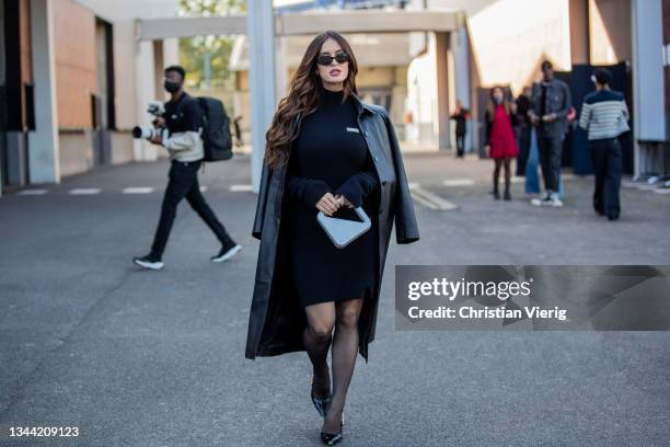 Natalia Barulich seen wearing black knitted dress, coat, grey bag, sheer tights outside Coperni during Paris Fashion Week - Womenswear Spring Summer...