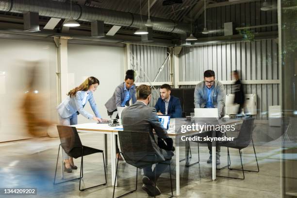 group of business people working on computers in the office. - business meeting blurry stock pictures, royalty-free photos & images