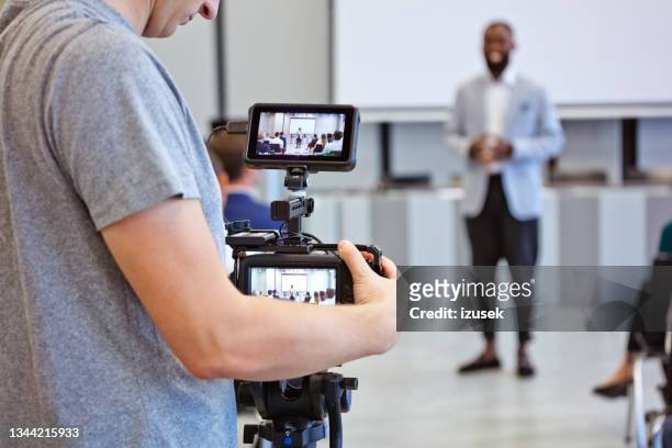 business semiar in the convention center - filming stock pictures, royalty-free photos & images