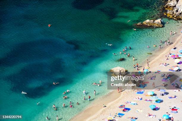 beach at the french riviera - villefranche sur mer imagens e fotografias de stock
