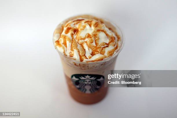 Starbucks Corp., ''Frappuccino'' iced coffee is arranged for a photograph in London, U.K., on Thursday, Dec 2011. Starbucks Corp., the world's...