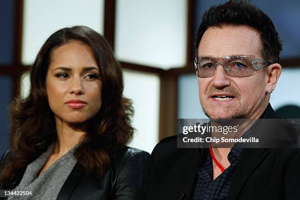 Bono , U2 lead singer and co-founder of ONE and , speaks during a round-table discussion with Alicia Keys, music artist and co-founder of Keep a...