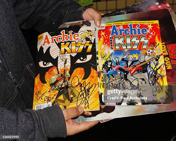 General Atmosphere as Gene Simmons and Paul Stanley of the Rock Band KISS sign copies of "Archie Meets KISS Part 1" comic book at Golden Apple Comics...