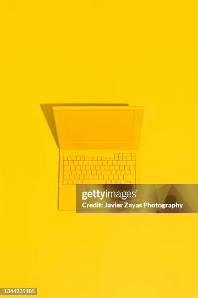 yellow laptop on yellow background - laptop colored background stock pictures, royalty-free photos & images