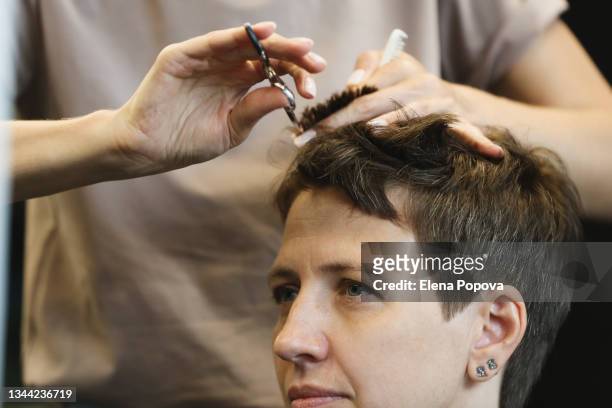 portrait young confidence woman getting new haircut - woman silver hair young ストックフォトと画像