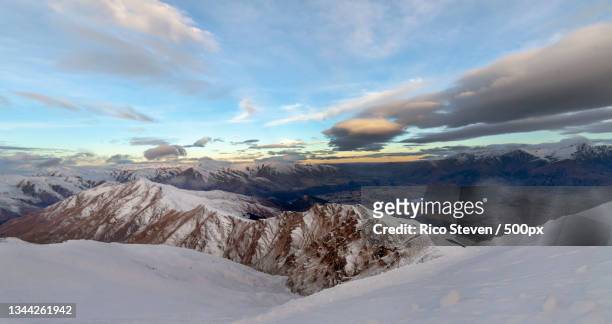 scenic view of snowcapped mountains against sky,coronet peak,new zealand - ski new zealand stock pictures, royalty-free photos & images