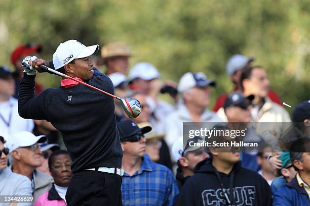 Tiger Woods watches his tee shot on the second hole during the first round of the Chevron World Challenge at Sherwood Country Club on December 1,...