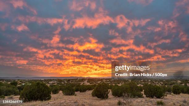 scenic view of landscape against sky during sunset,santa fe,new mexico,united states,usa - santa fé imagens e fotografias de stock