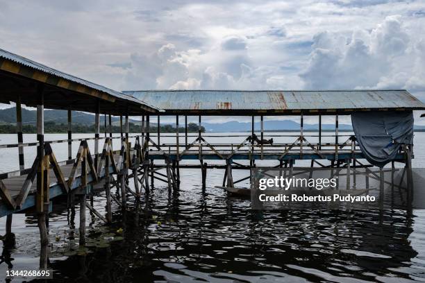 Woman looks for fish at Lake Sentani on October 01, 2021 in Jayapura, Irian Jaya, Indonesia. Abar village, located in the middle of Lake Sentani, was...