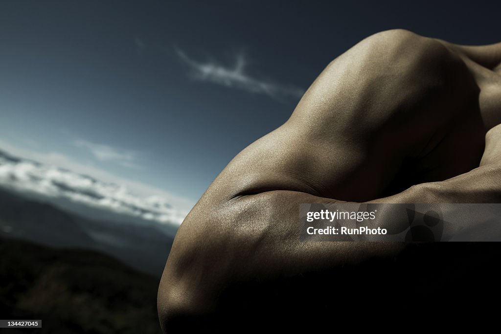 Young man's arm close-up in nature