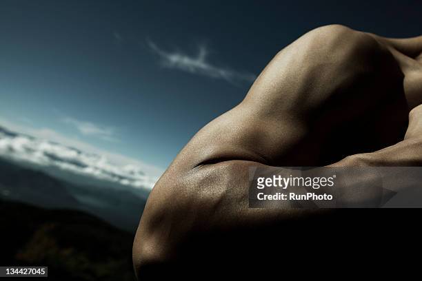 young man's arm close-up in nature - human arm stock pictures, royalty-free photos & images