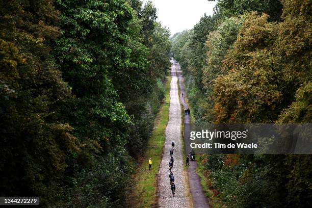 General view of Team INEOS Grenadiers passing through Drève des Boules d’Hérin - Tranchée Wallers Arenberg cobblestones sector during the 118th...