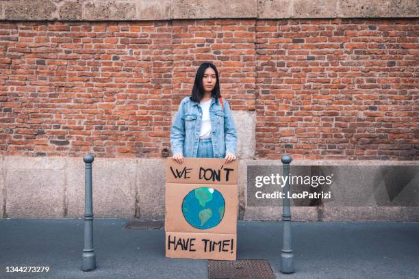 young student activist - climate change conference stock pictures, royalty-free photos & images