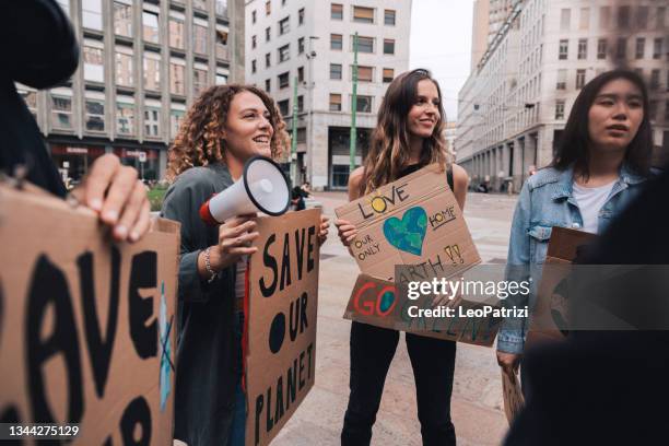 students and young people protesting for climate emergency - climate protest stock pictures, royalty-free photos & images