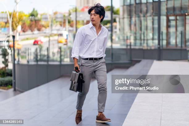 businessman running late in office - businessmen casual not phone walking stock pictures, royalty-free photos & images