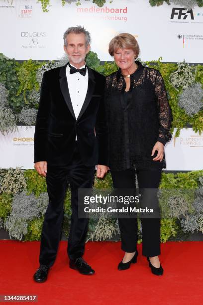 Ulrich Matthes and Monika Gruetters arrive for the Lola - German Film Award at Palais am Funkturm on October 01, 2021 in Berlin, Germany.