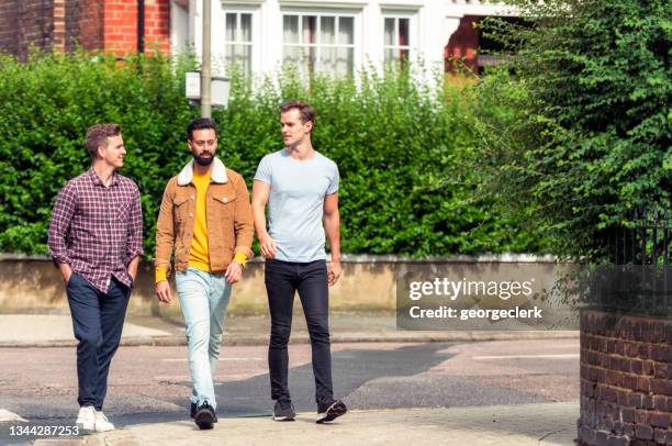 three male friends in london - small group of people outside stock pictures, royalty-free photos & images