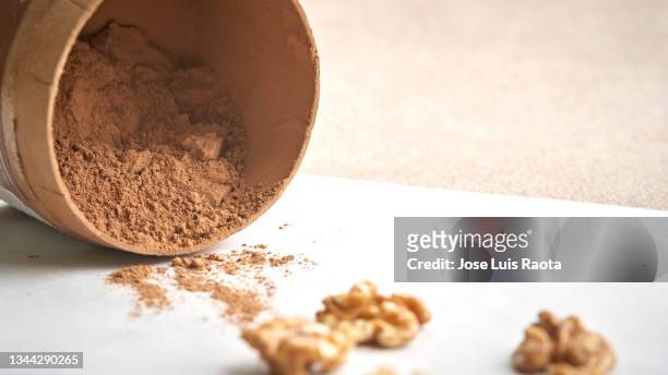 cocoa powder. confectionery, pastry concept. christmas with cocoa and walnut - protein powder stock-fotos und bilder