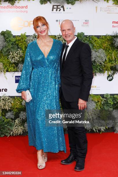 Andrea Sawatzki and Christian Berkel arrive for the Lola - German Film Award at Palais am Funkturm on October 01, 2021 in Berlin, Germany.
