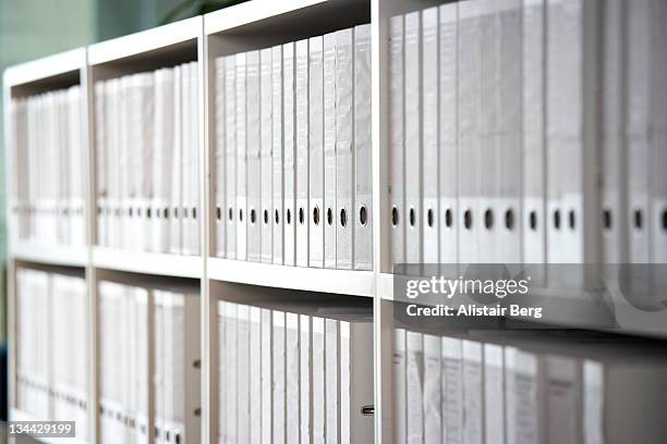 files on shelves in an office - lever arch stock pictures, royalty-free photos & images