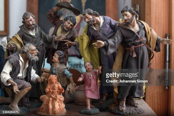 Baroque style figurines for a Bavarian Christmas crèche are seen in the workshop of woodcarver Herbert Haseidl on December 1, 2011 in Oberammergau,...