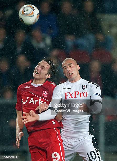 Luuk de Jong of FC Twente and Pajtim Kasami of Fulham go up for a header during the Europa League match between FC Twente and Fulham FC at the...