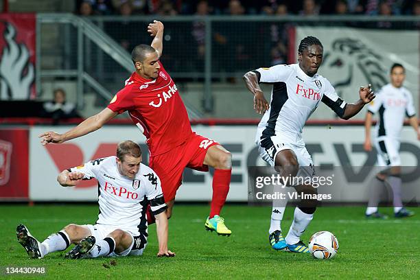 Nacer Chadli of FC Twente competes with Dickson Etuhu of Fulham during the Europa League match between FC Twente and Fulham FC at the Grolsch Veste,...