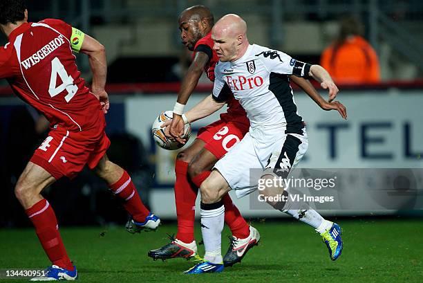 Dwight Tiendalli of FC Twente competes with Andrew Johnson of Fulham during the Europa League match between FC Twente and Fulham FC at the Grolsch...