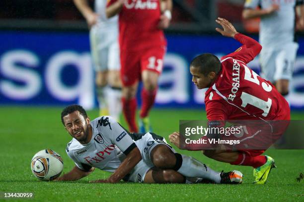 Moussa Dembele of Fulham clashes with Roberto Rosales of FC Twente during the Europa League match between FC Twente and Fulham FC at the Grolsch...