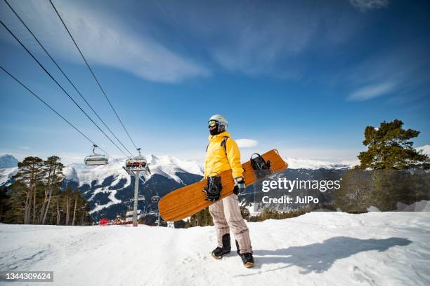 young adult woman snowboarding in mountains - pro russian stock pictures, royalty-free photos & images