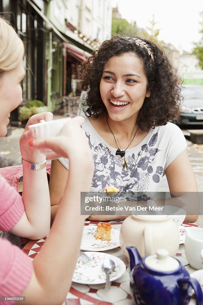 Woman talking to friend during break.