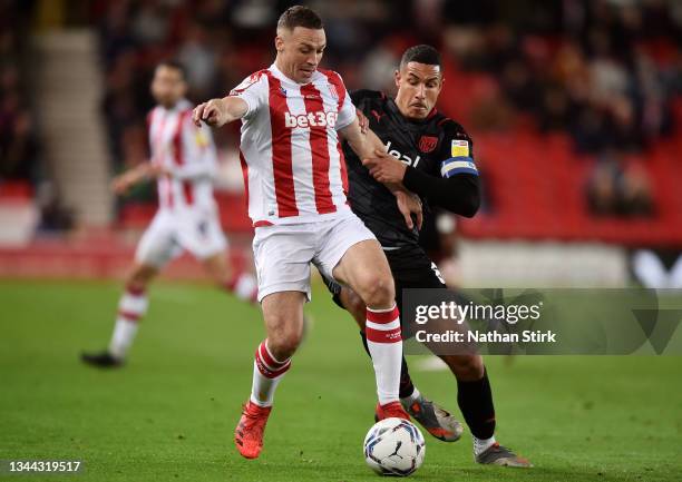 James Chester of Stoke City and Jake Livermore of West Bromwich Albion battle for the ball during the Sky Bet Championship match between Stoke City...