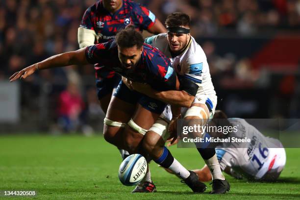 Steven Luatua of Bristol spills the ball as Josh Bayliss of Bath challenges during the Gallagher Premiership Rugby match between Bristol Bears and...