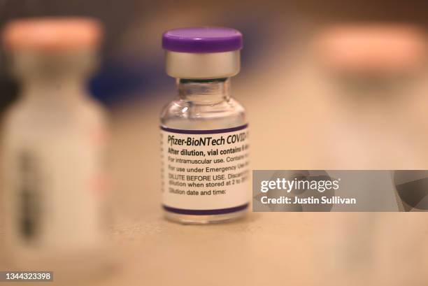Vial of Pfizer COVID-19 booster vaccination sits on a table at a vaccination booster shot clinic on October 01, 2021 in San Rafael, California. Marin...