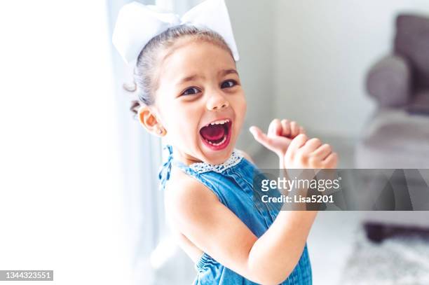wild child, excited and expressive little girl with big personality screams in happiness - cute girl toddler imagens e fotografias de stock