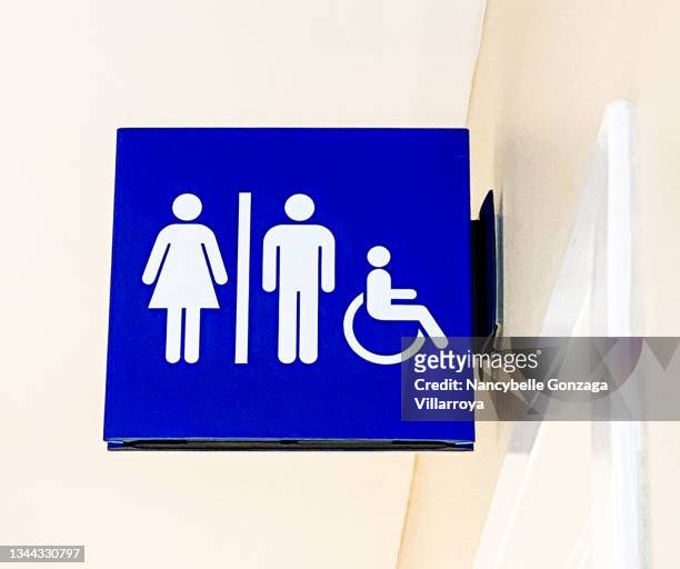 a blue and white restroom  sign for a toilet - disability icon stock pictures, royalty-free photos & images