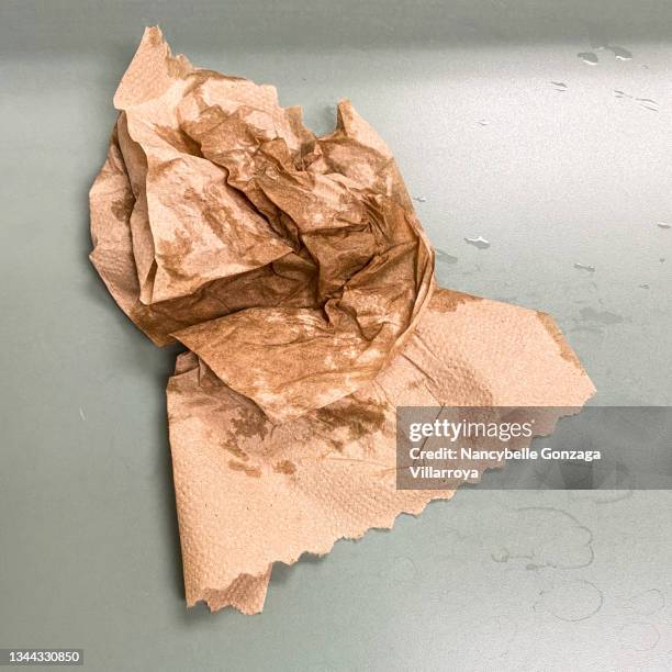 crumpled brown wet papertowel - brown paper towel stock pictures, royalty-free photos & images