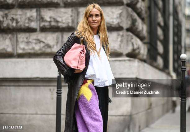 Blanca Miro Scrimieri is seen wearing a Loewe outfit with pink bag outside the Loewe show during Paris Fashion Week S/S 2022 on October 01, 2021 in...