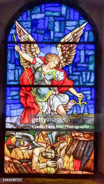 stained glass window with archangel michael, st. blaise church, vodnjan, istria, croatia - stained glass angel stock pictures, royalty-free photos & images