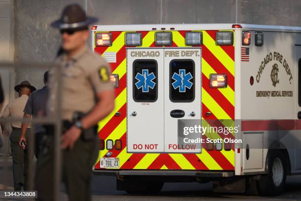 The remains of an Illinois state trooper who was discovered with a gunshot wound to the head along I94, south of downtown, arrive at the Cook County...